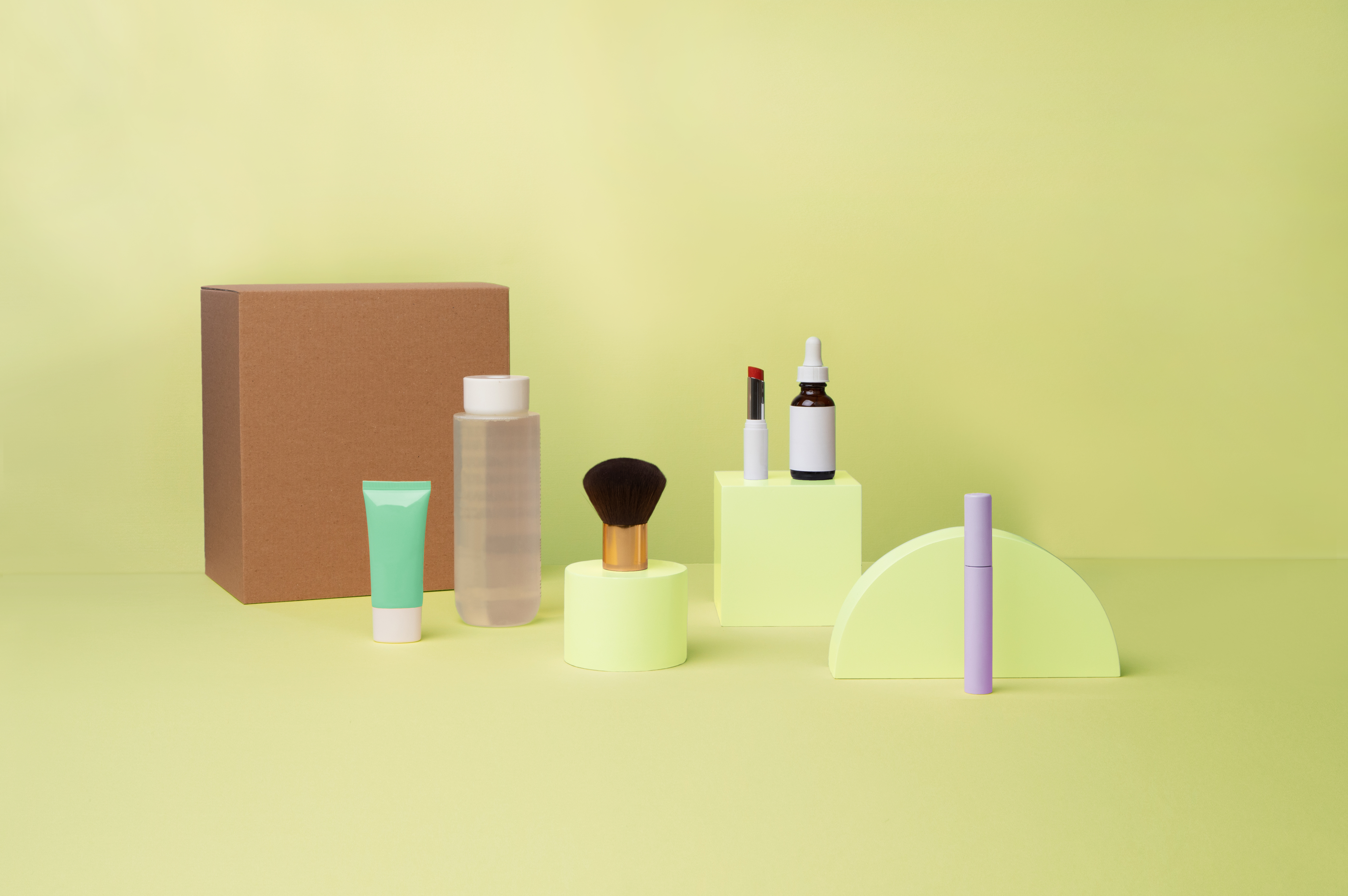 Cosmetics on green background